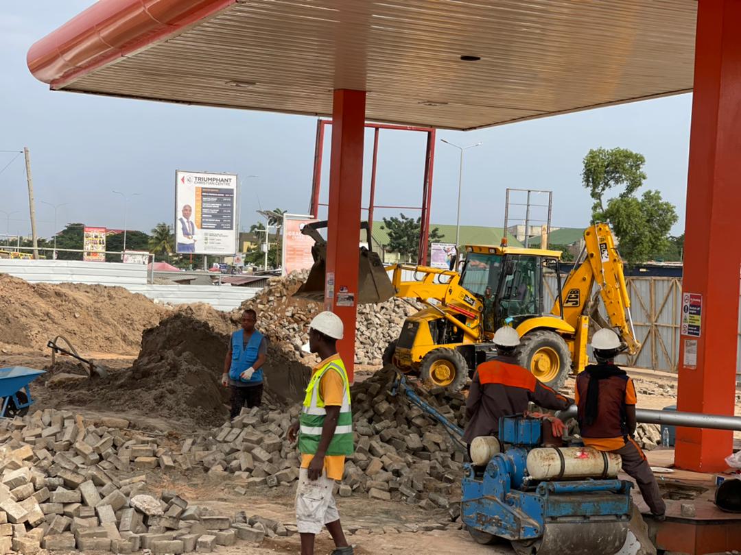 Excavator and crew on an active site
